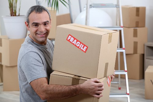 Furniture removals team handling a Chelsea townhouse move