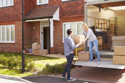 Student removal team planning a move in Chelsea with boxes and furniture