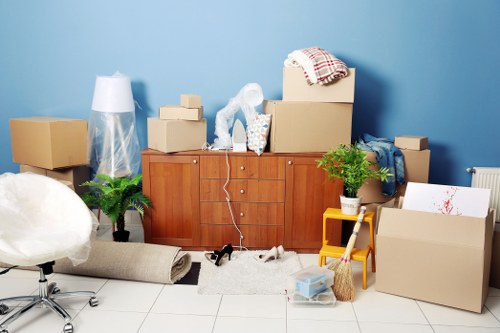 Removal company team handling a Chelsea home move with boxes and furniture