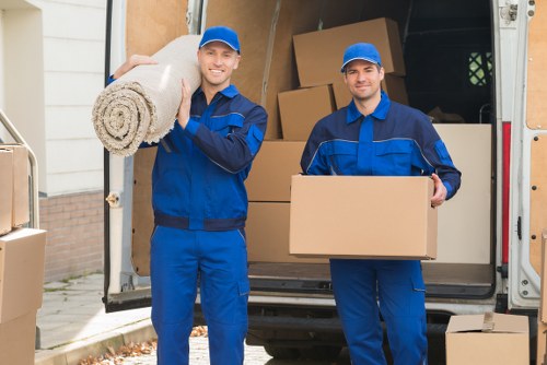 Movers assessing a property route before loading begins