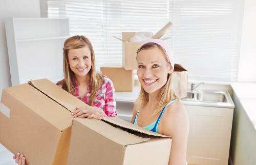 Packed boxes and furniture ready for student removals in Chelsea